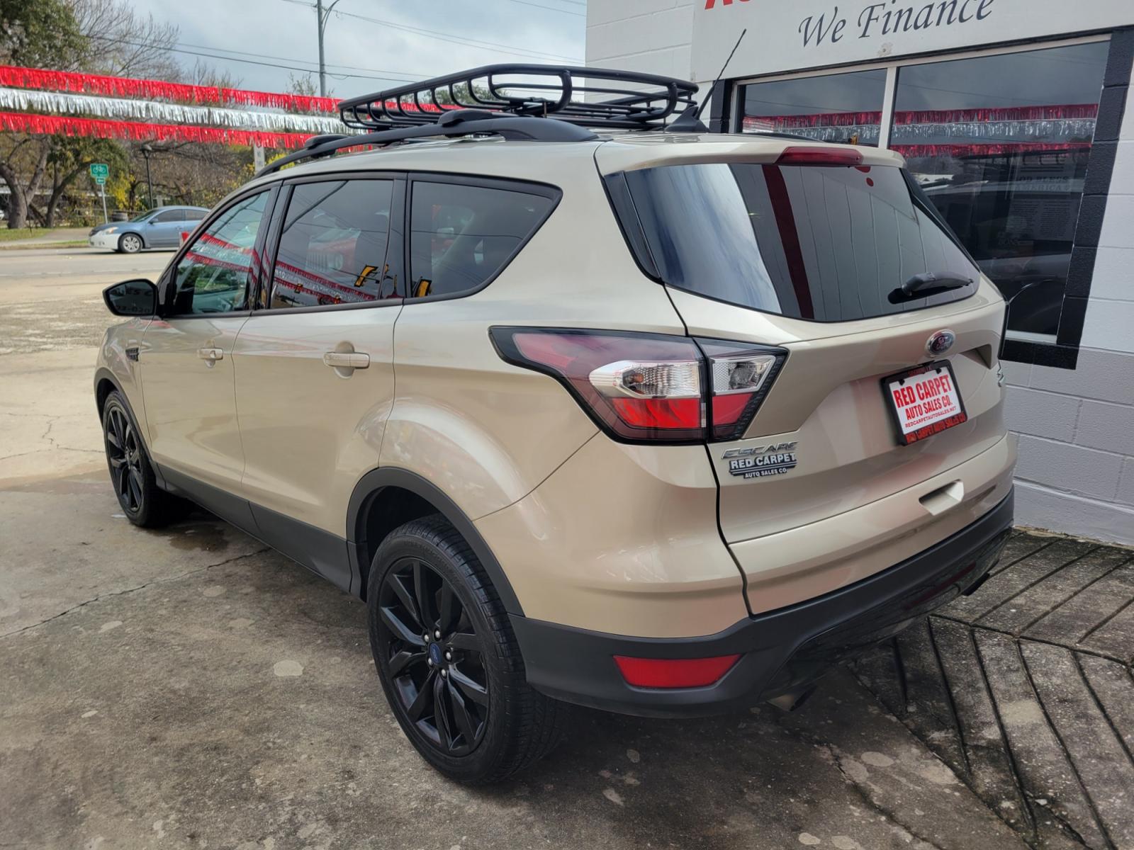 2018 Gold Ford Escape (1FMCU9GD5JU) with an 1.5L I4 F DOHC 16V engine, Automatic transmission, located at 503 West Court, Seguin, TX, 78155, (830) 379-3373, 29.568621, -97.969803 - Photo #3